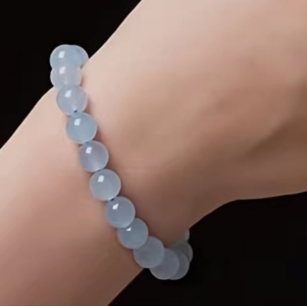 AQUAMARINE 10mm STONE STRETCH BRACELET.